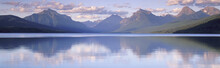 This Is Lake McDonald. The Surrounding Mountains Are Reflected In The Lake.