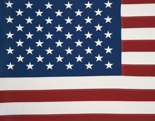 Wall Mural - This is an American flag sitting flat. We see all of the stars on the blue background with the red and white stripes also laying flat moving in a straight horizontal direction, but not completely shown.