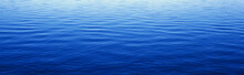 These Are Water Reflections In Lake Tahoe. The Water Is A Deep Blue And The Small Ripples In The Water Form A Pattern.