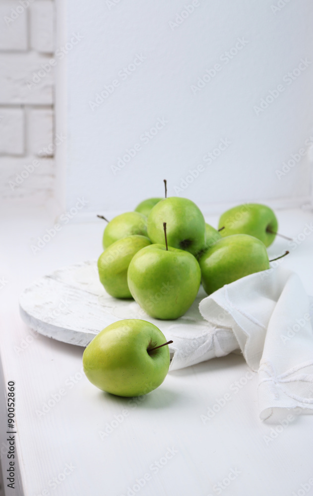 Green apples on windowsill, closeup