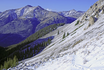 Wall Mural - Snow capped mountain peaks in alpine scene after snow storm