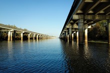 The Atchafalaya Basin Bridge And The Interstate 10 (I-10) Highway Seen From Below On The Water Level Of The Atchafalaya Bayou On Sunny Late November Evening In 2012 Near Henderson, Louisiana.
