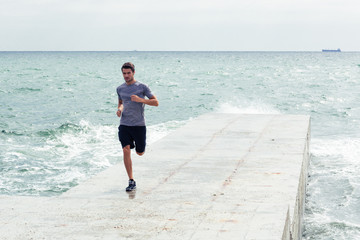 Sticker - Man running at the beach outdoors