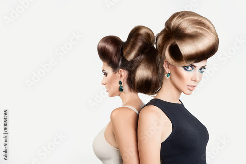 Naklejka na szybę Two beautiful women in studio. Both with creative hairstyle and