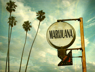 Wall Mural - aged and worn vintage photo of marijuana sign with palm trees