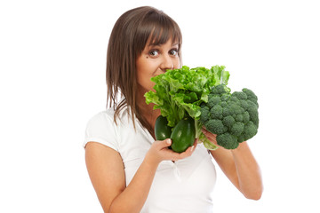 Canvas Print - Young woman holding broccoli