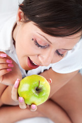 Poster - Young woman eating apple