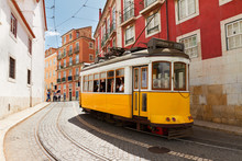 Tram On Narrow Street Of Alfama, Lisbon