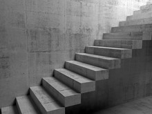 Abstract Concrete Interior With Cantilevered Stairs