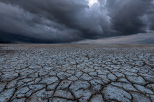 Storm Clouds And Dry Soil