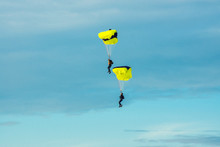 Two Parachutist On Bright Parachutes