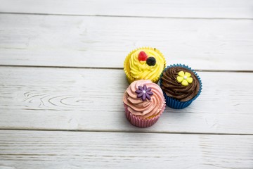 Wall Mural - Delicious cupcakes on a table