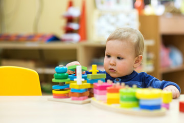 little boy playing in a kindergarten