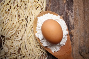 Canvas Print - Making noodle with egg and wheat flour