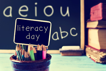 Wall Mural - text literacy day in a chalkboard, in a classroom, filtered