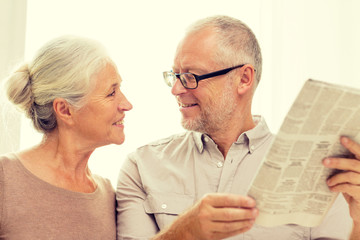 Sticker - happy senior couple reading newspaper at home