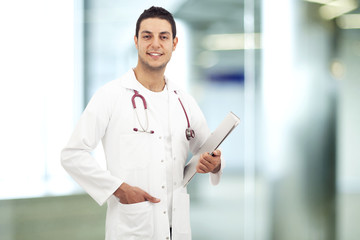 Young doctor man standing in hospital