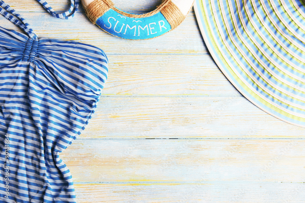 Summer accessories on wooden background