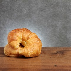 croissant bakery on teakwood table