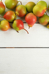 Poster - Fresh pears on white wooden background