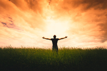 Wall Mural - silhouette of man and sunshine