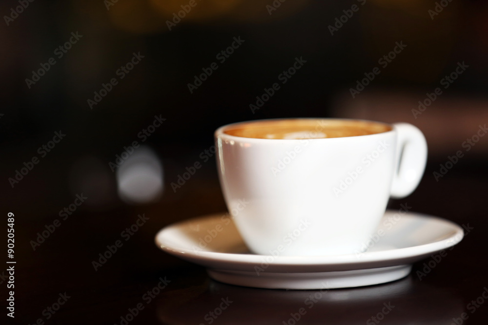 Cup of cappuccino on bar counter