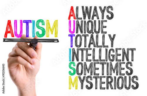 hand-with-marker-writing-the-word-autism