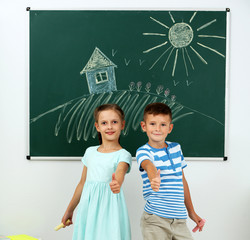 Wall Mural - Children near blackboard at school