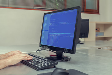 developer working on source codes on office computer
