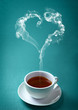 Cup of hot tea on the emerald green background