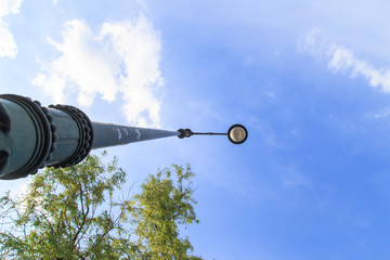 Street lamp and blue sky in the background