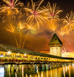 Fireworks over Chapel bridge in Lucerne, Switzerland 