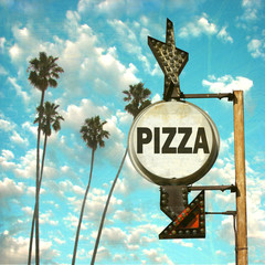 Wall Mural - aged and worn vintage photo of pizza sign with palm trees