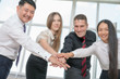 © petunyia - Multiracial successful business people with thumbs up gesture