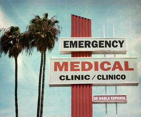 Wall Mural - aged and worn vintage photo of emergency medical clinic sign