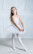 © jutaphoto - A little adorable young ballerina in a playful mood in the inter