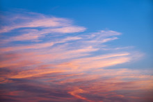 Pink And Orange Clouds In A Blue Sky At Sunset