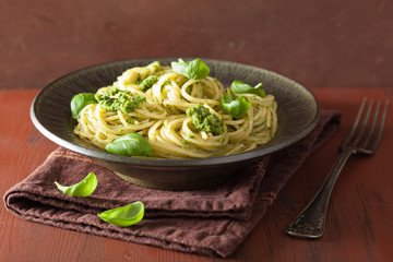 Wall Mural - spaghetti pasta with pesto sauce over rustic table