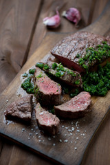 Poster - Medium rare grilled barbecue beefsteak with chimichurri sauce