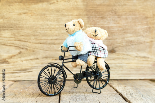 Teddy Bear Riding a Vintage Toy bicycle - Buy this stock photo and explore similar images at