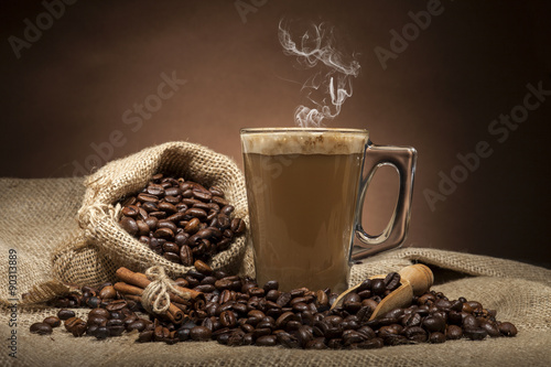 Fototapeta na wymiar Glass cup with coffee beans