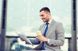 © Syda Productions - young businessman with coffee and newspaper