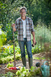© jackfrog - Looking at camera, gardener with a vegetable crate at his feet
