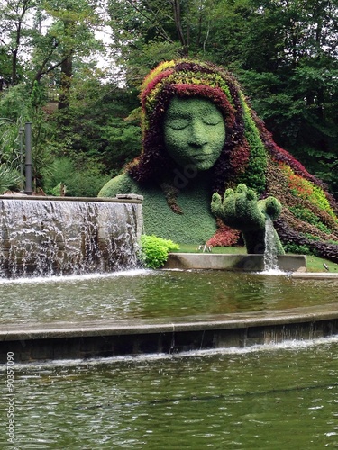 Amazing garden landscape design with a green sculpture of a mother nature  Stock Photo | Adobe Stock