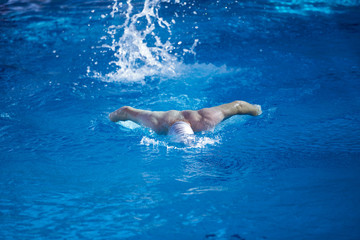 Wall Mural - swimmer excercise on indoor swimming poo