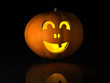 Halloween pumpkin on a black reflective surface