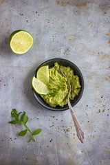 Sticker - Guacamole dip and lime on rustic  background