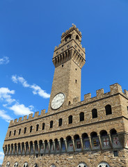 Wall Mural - Florence Italy Historic clock tower building and blue sky