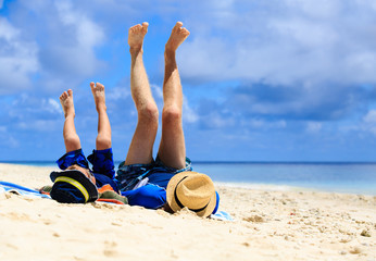 father and son having fun on the beach