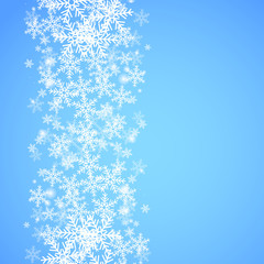 Wall Mural - Abstract blue Christmas background with snowflakes.